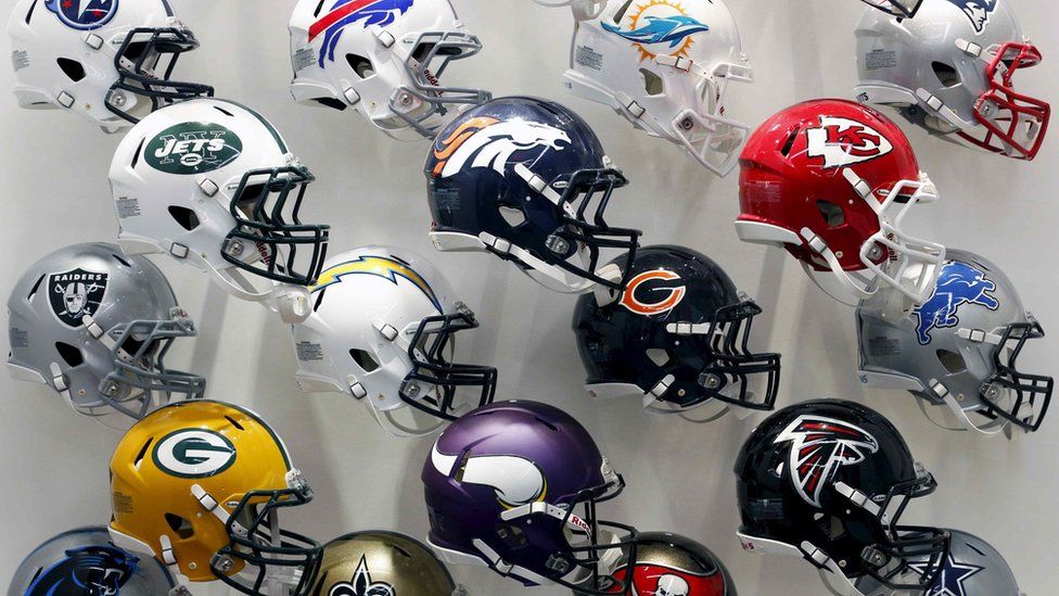 NFL team helmets are displayed at the NFL Headquarters in New York