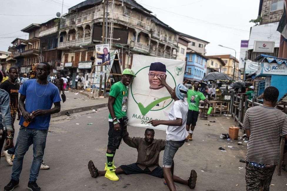 Supporters of the president of Sierra Leone and leader of Sierra Leone People's party (SLPP), Julius Maada Bio, celebrate in the streets following his re-election in Freetown - Tuesday 27 June 2023