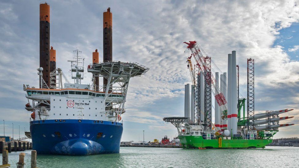 Installation vessels Apollo and Vole Au Vent moored at REBO heavy load terminal in Ostend port, Belgium loading wind turbines for Sea Made wind farm.