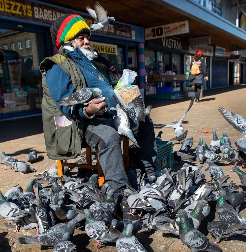 Man with pigeons, Oastler Shopping Centre, John Street, Bradford