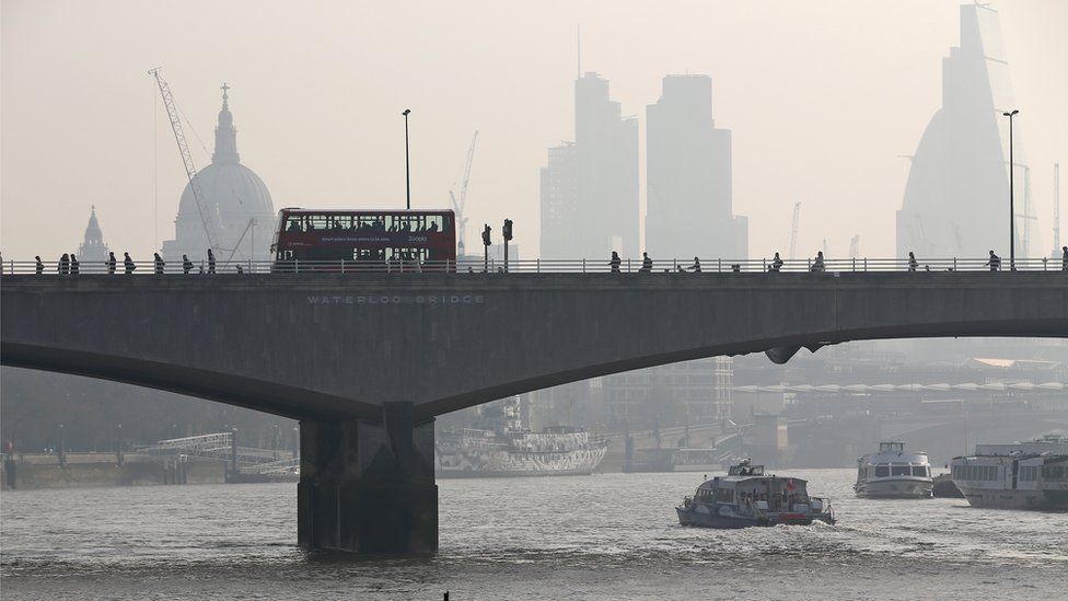 File image from 10 April 2015 of London's Waterloo Bridge, with St Paul's Cathedral visible through smog in the background