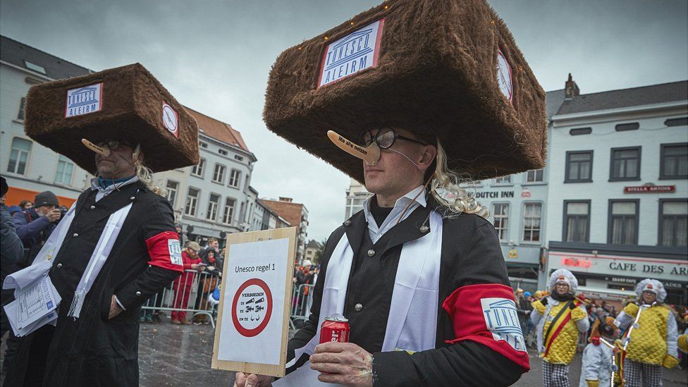 People wearing fake noses and fur hats intended to depict Orthodox Jews during Aalst carnival, 23rd February 2020