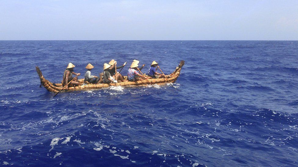 One of the two hand-built canoes being paddled toward Okinawa Prefecture in Japan