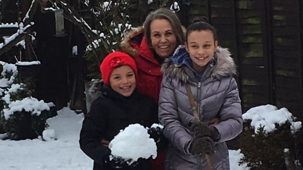 Caroline Tobierre with her children, including Charlotte, right