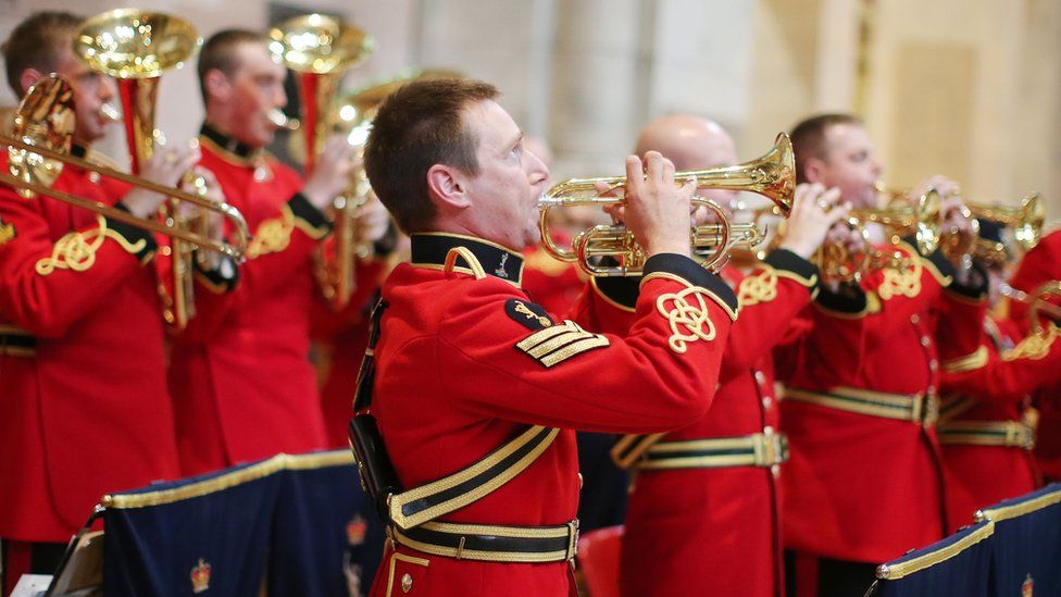 A military band plays during the service