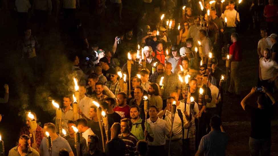 White nationalists march through the University of Virginia Campus with torches in Charlottesville, USA. August 2017