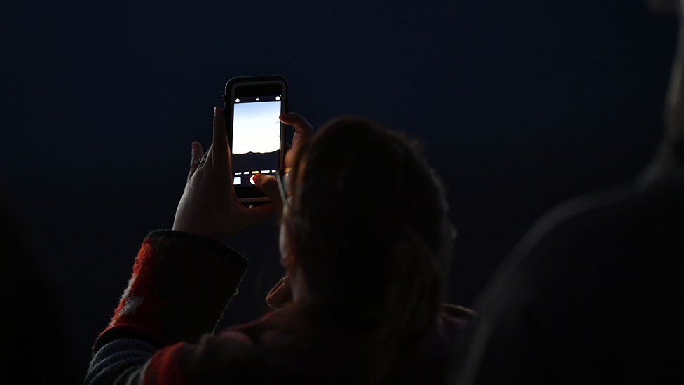 Man taking pictures in Burnsville, USA