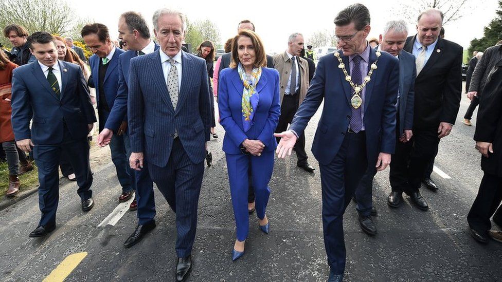 Mayor of Derry, John Boyle, steps over the Irish border with Nancy Pelosi
