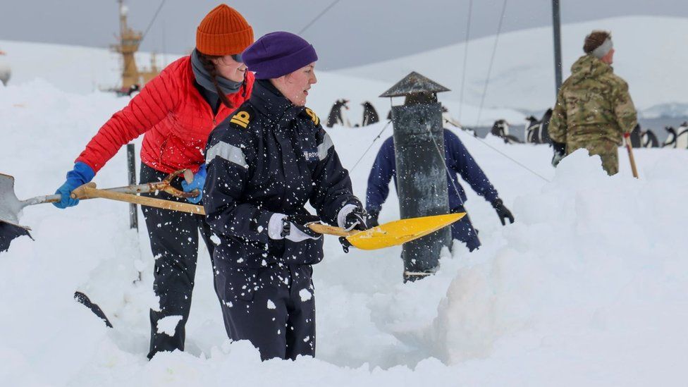 The Royal Navy personnel from HMS Protector digging out the Port Lockroy site