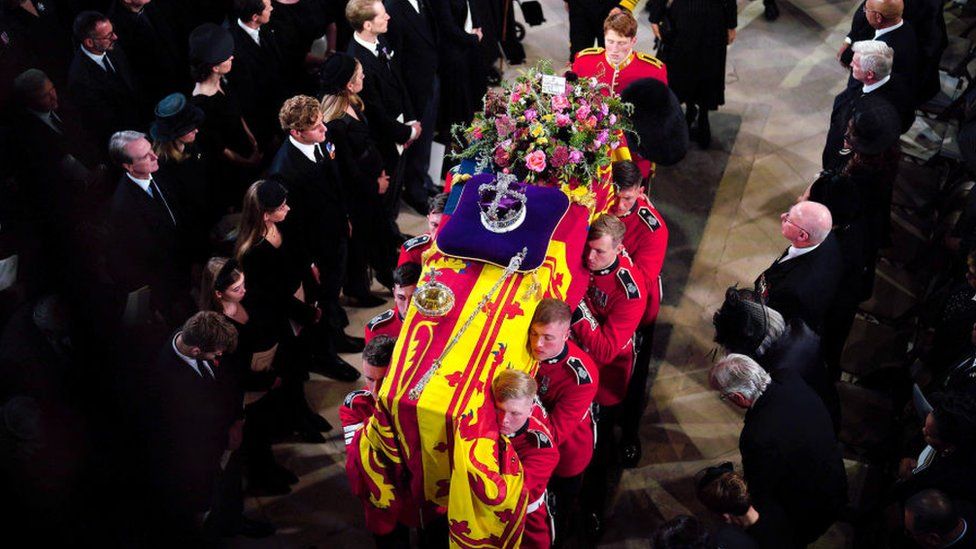 The Queen's coffin being carried into St George's Chapel