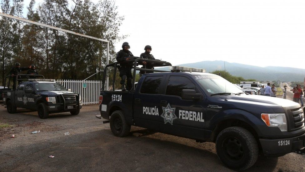 Federal Police leaving the ranch del Sol located in the municipality of Tanhuato, state of Michoacan, Mexico, after a confrontation which ended with 42 civilians and one police officer dead.