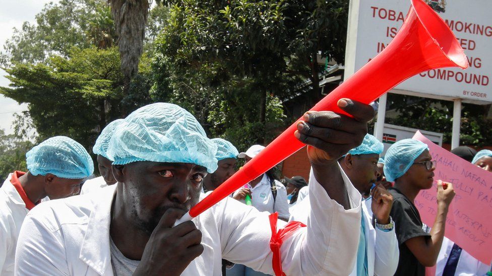 A medical practitioner participates in a demonstration against the government's failure to hire trainee doctors, outside the Ministry of Health in Nairobi, Kenya, March 4 2024