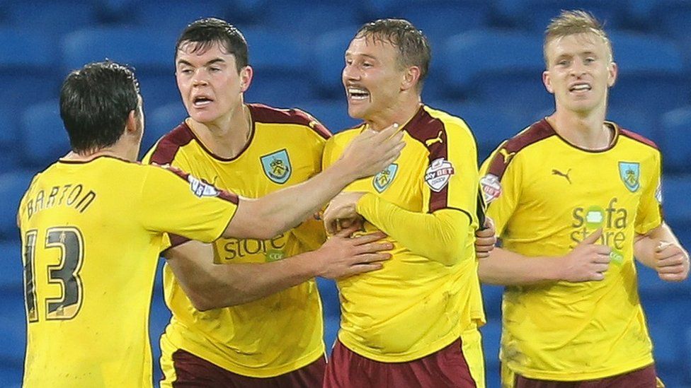 Burnley celebrate an unlikely draw against Cardiff