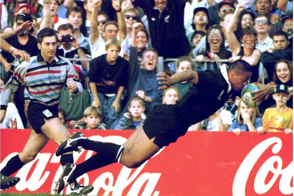 Jonah Lomu scores his side's first try against England during their Rugby World Cup semi-final match in South Africa in 1995