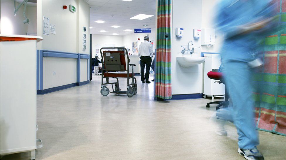 An empty wheelchair on an accident and emergency ward