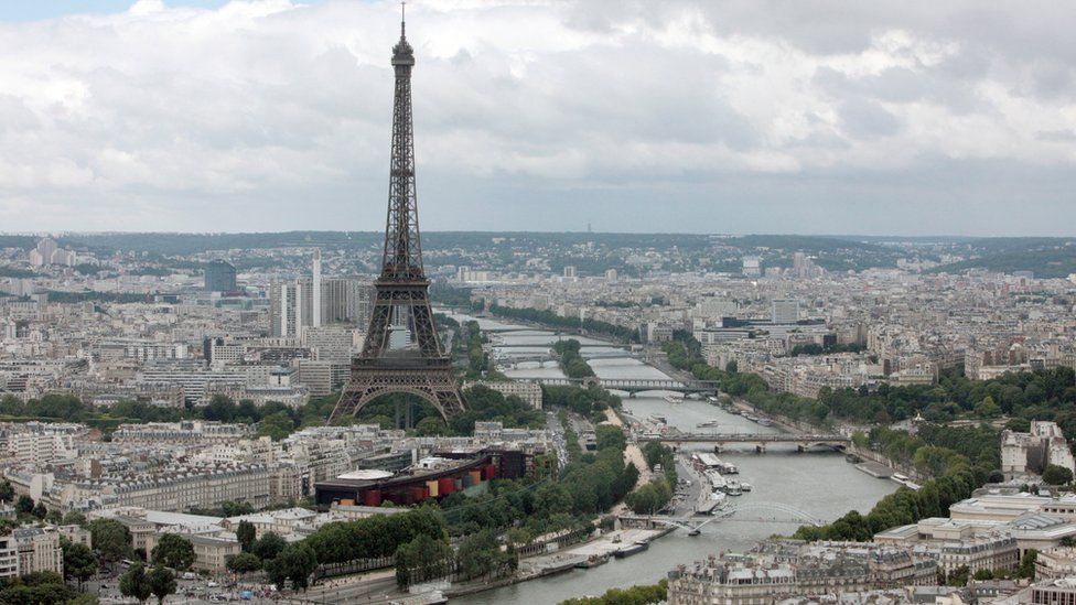 This aerial picture taken on July 14, 2012 shows a general view of Paris with the Eiffel Tower (L) and the Seine River.