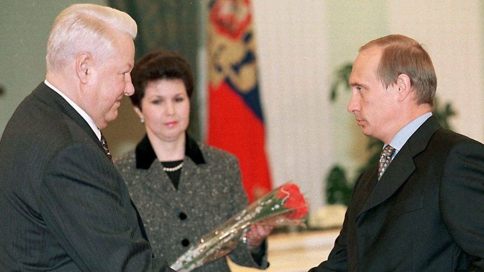 Russian President Boris Yeltsin (L) shakes hands with the chief of the Federal Security Service Vladimir Putin, officially thanking him for the service during an awarding ceremony in the Kremlin in Moscow, 22 February 1999