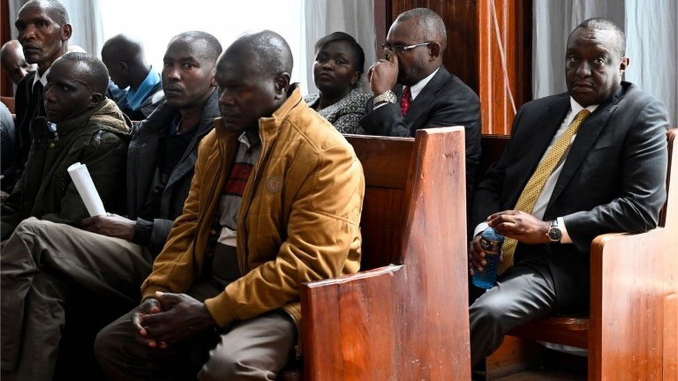 Henry Rotich (R back row) sits at the Milimani Law Court in Nairobi as he attends an hearing to face corruption charges, on July 23, 2019