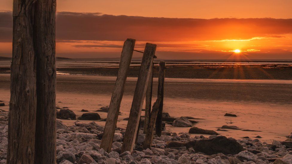 Sunset at the old wharf at Morfa beach in Conwy