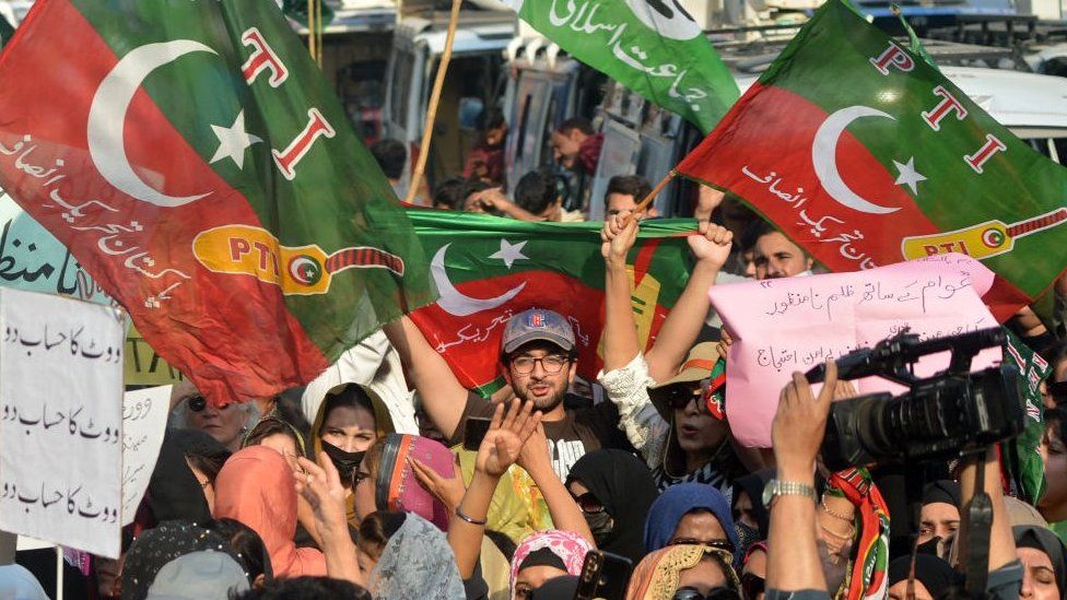 Supporters of the PTI party protest outside an election commission office in Karachi on February 10, 2024
