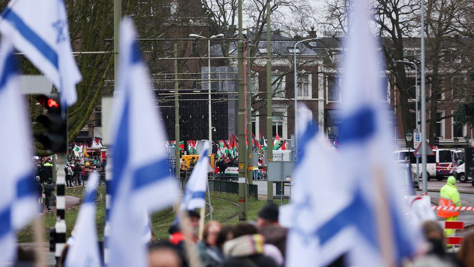 Pro-Israeli and pro-Palestinian protesters gather near the ICJ