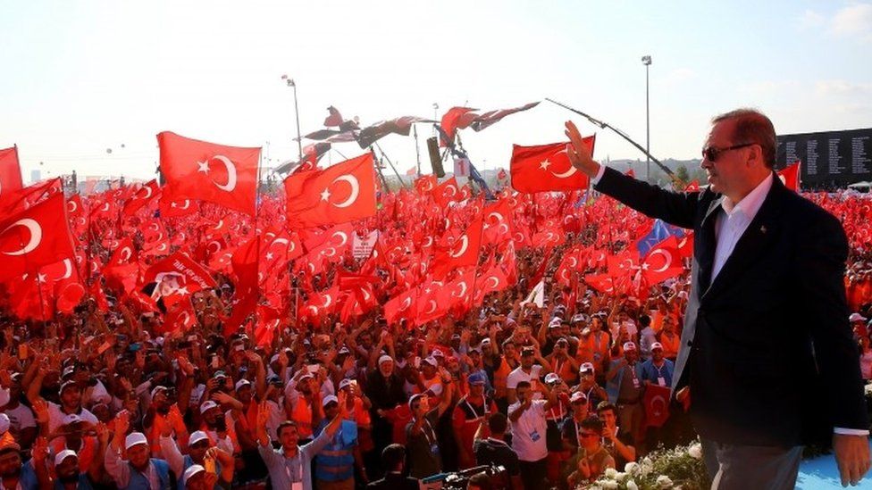 Turkish President Recep Tayyip Erdogan greeting people as they gather at Yenikapi in Istanbul during a rally against failed military coup on July 15