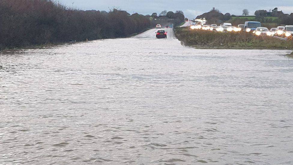 A wide image of the A303 submerged in flood waters