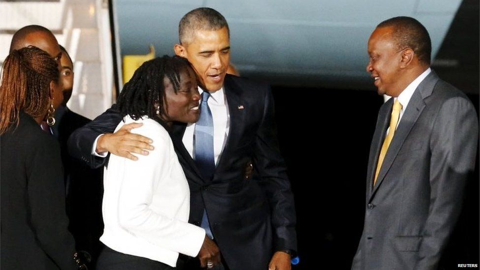 President Barack Obama (centre) hugs his half-sister Auma
