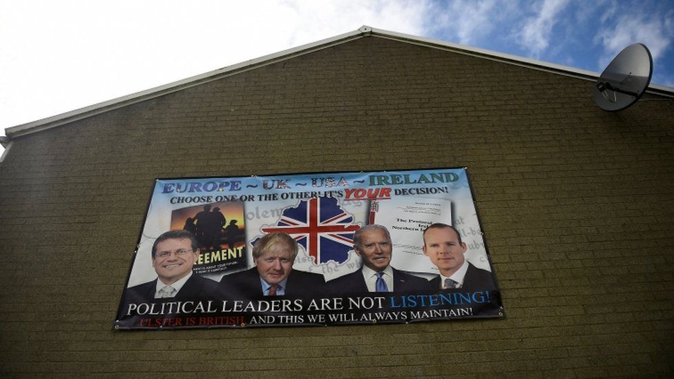 An anti-Northern Ireland Protocol poster hanging on a building in Lisburn