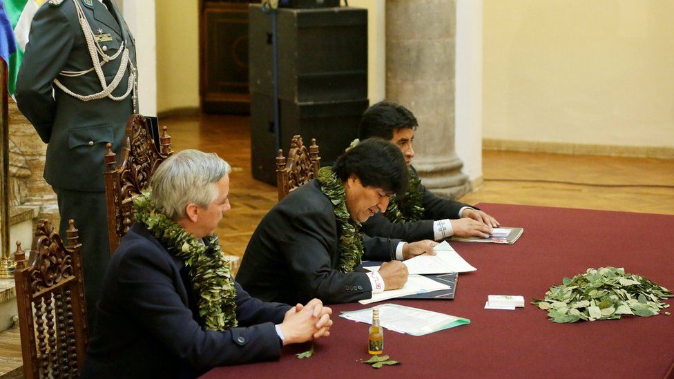 Bolivia's President Evo Morales signs documents related to the approval of a new law about coca leaves at the presidential palace , 8 March 2017