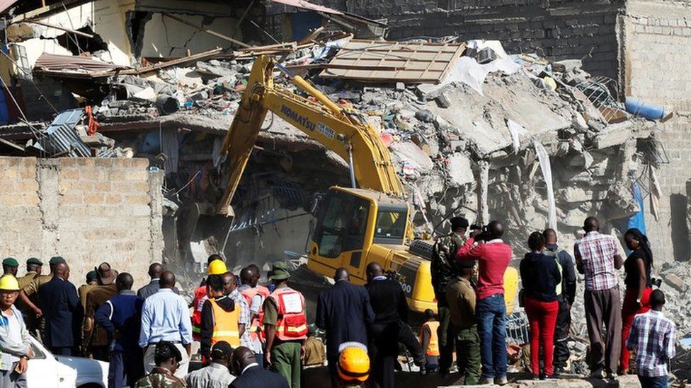 Rescue workers at the scene after a building collapsed in a residential area of Nairobi, 13 June 2017