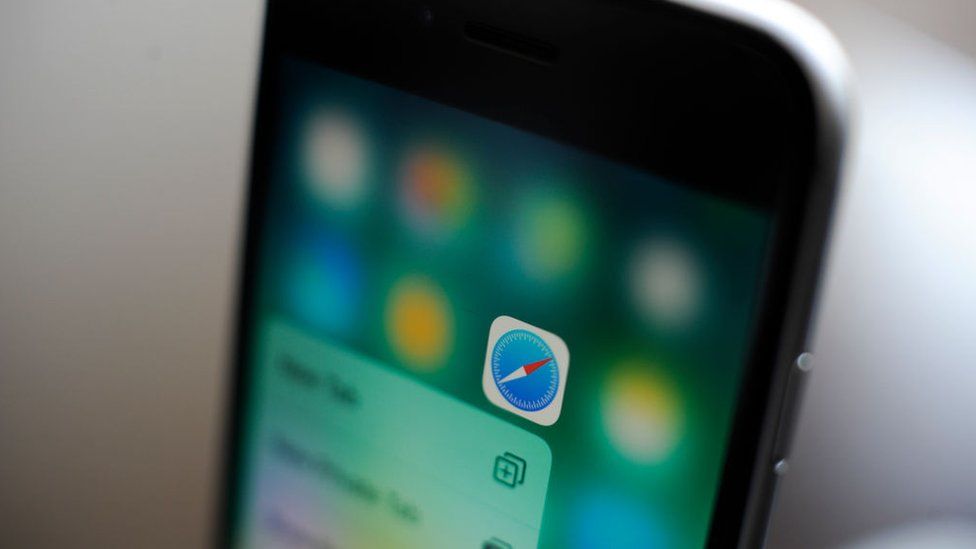 Close up of an iPhone with Safari app highlighted