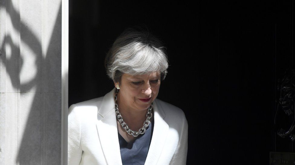 Britain's Prime Minister, Theresa May, waits on the doorstep of no 10 to greet the Prime Minister of Estonia