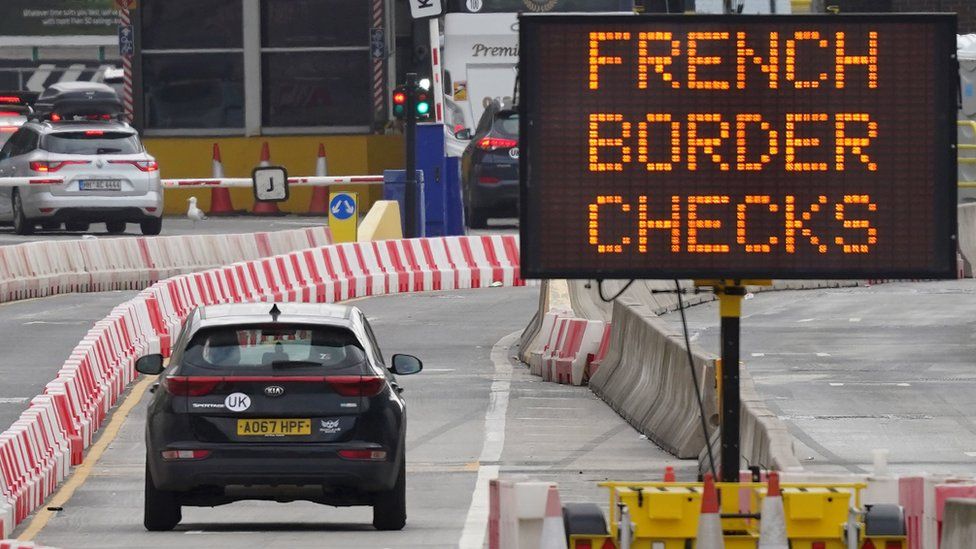 Car approaches border checks in Dover. Next to sign that readers "French Border checks"