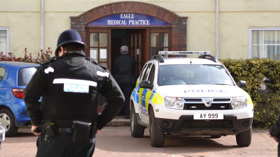 Police outside the Eagle Medical Practice in Alderney