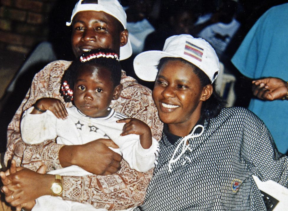 A young Susan Kigula with partner Constantine and young daughter.