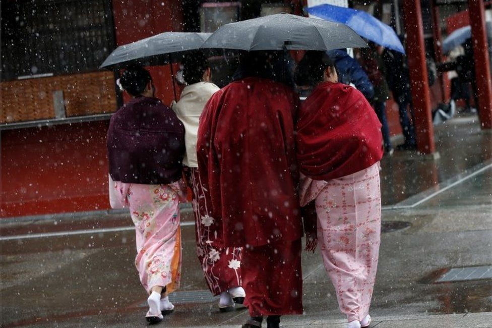 Women in traditional costume walk in Asakusa district, Tokyo