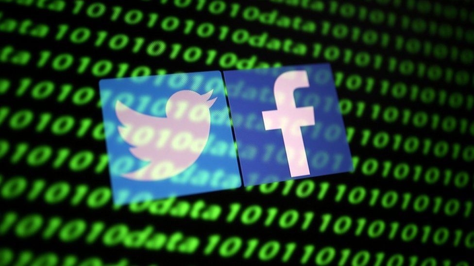 Twitter and Facebook logos are shown along with binary cyber codes