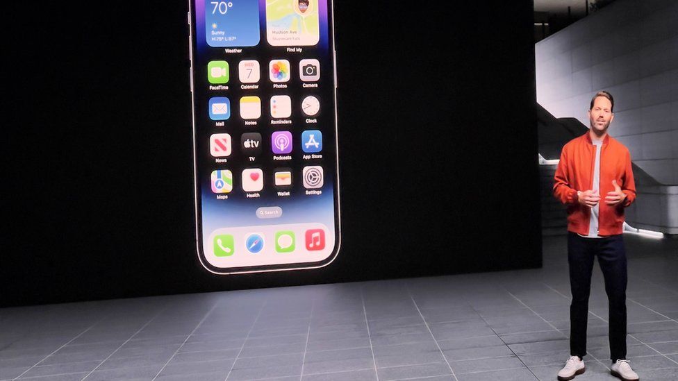A man presents at the iPhone 14 launch event