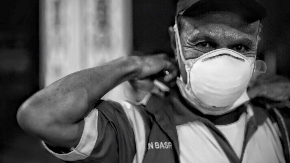 A man in Indonesia's central Kalimantan province wears an N95 face mask