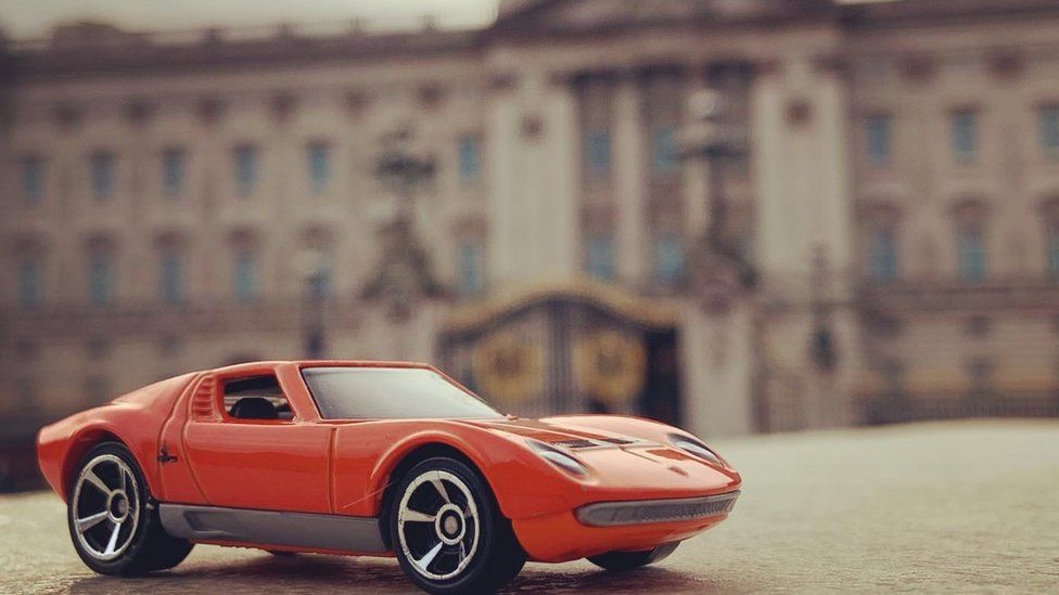 Toy car in front of Buckingham Palace
