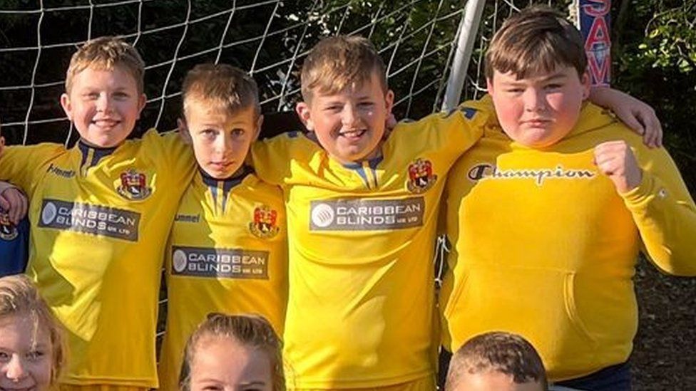 St Gregory Primary School pupils in AFC Sudbury shirts or colours