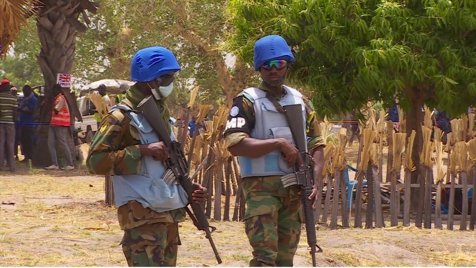 Armed men during a food drop in South Sudan