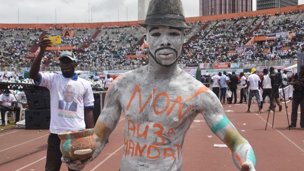 A man painted up at a rally against the candidacy of Alassane Ouattara at a stadium in Abidjan, Ivory coast