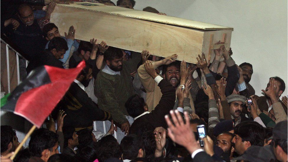 Supporters carry Ms Bhutto's coffin after her body was released from hospital following her assassination December 2007