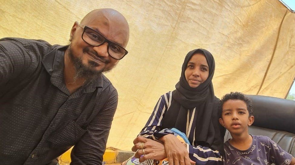 Wathig Ali and his family at the airstrip near Khartoum