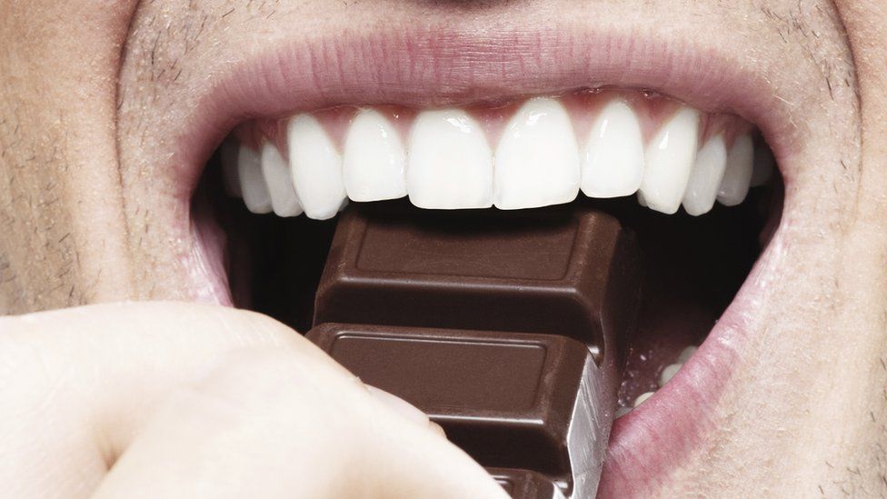 Mouth devouring chocolate