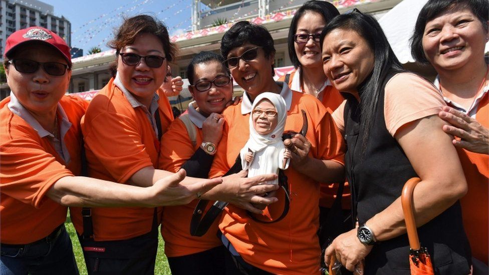 Halimah Yacob supporters with a doll of her in Singapore (13 Sept)