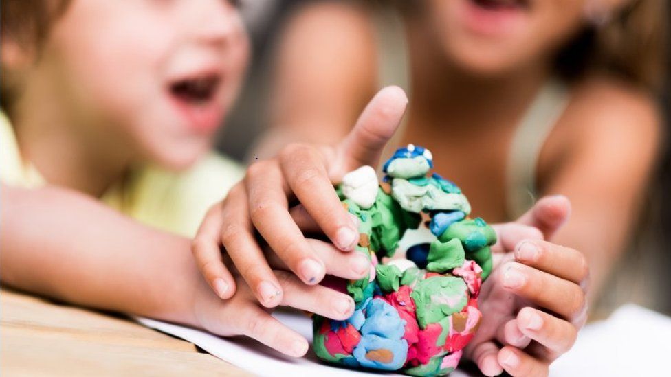 Children play with modelling clay