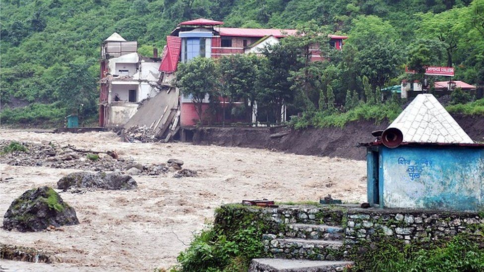 A portion of college building is seen collapsed along the river Maldevta after heavy rains in Dehradun on August 14, 2023